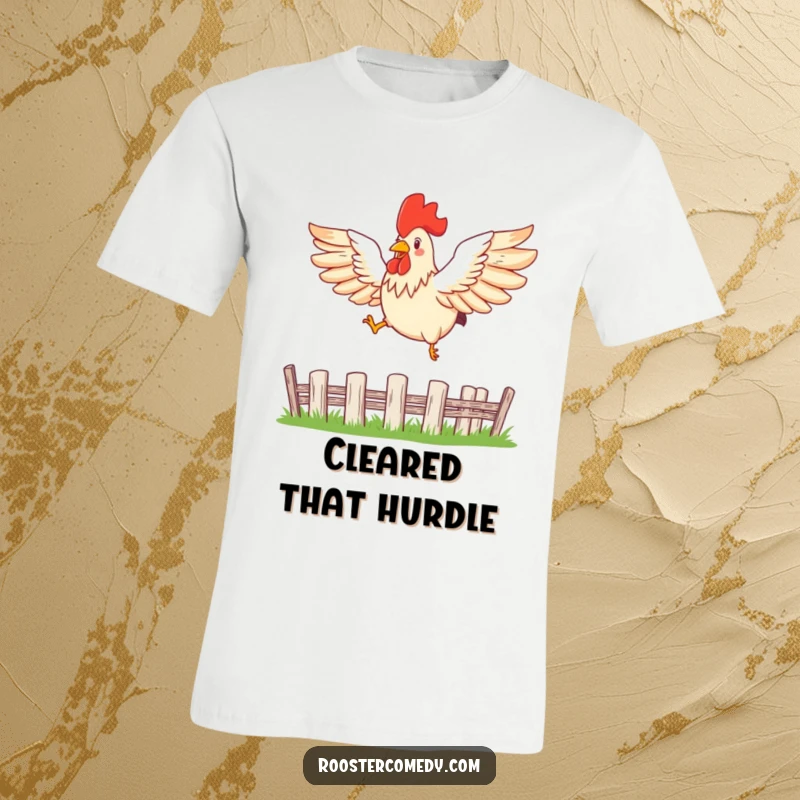 Funny rooster t-shirt showing a bird with wings spread wide, mid-leap, clearing a fence with determination.